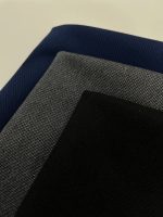 نمای نزدیک پارچه شلوار گاباردین زنانه در سه رنگ سرمه ای طوسی و مشکی